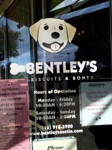 The glass door to the dog boutique and bakery features a caricature of Bentley, the yellow Labrador retriever that inspired Michelle Taylor to open her store.